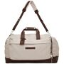Brunello Cucinelli Beige Active Duffle Bag  - CC008BEIGE - Size: UNI - Gender: male Canvas duffle bag in beige. Grained leather trim in brown throughout. Twin rolled carry handles featuring detachable ID tag with pin-buckle fastening and press-stud fastening at top. Detachable and adjustable shoulder strap with tonal nylon strap pad and lanyard clasp fastening. Leather logo patch and zippered pocket at face. Zippered pockets at sides. Bumper studs at base. Two-way zip closure at main compartment. Patch pockets, zippered pockets, and leather logo patch at interior. Water-resistant nylon taffeta lining in grey. Logo-engraved silver-tone hardware. Approx. 25.5 length x 11 height x 12 width. Supplier color: Beige 