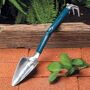Garrett Wade Double Function Combo Garden Tool Our  Trake  is a handy gardening tool that elegantly combines two of the most common gardening tasks that you perform; weeding and planting/transplanting. Made of polished cast-aluminum, it has a sure-grip rubberized handle that is comfortable to hold. Overall length of the Trake is 17, giving you a significant leverage advantage for hard soil or tenacious roots. The trowel has inch demarcations to help you gauge planting depth, and a 6½ long head, 3 wide. Double Function Combo Garden Tool 