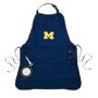 EVERGREEN ENTERPRISES INC University of Michigan Wolverines Logo Grilling Utility Apron This is the ultimate grilling apron! You'll be ready to tackle any backyard BBQ with all of the fun features this apron has to offer. Made from heavy-duty cotton canvas, your favorite team's logo is embroidered on the center of the chest. Apron features five separate pockets for holding tools and other grilling essentials, a rope cord for hanging a towel, and a metal retractable bottle opener tool! There is even an insulated bottle or can pocket on the front - oh yeah! Easy adjustable neck strap 