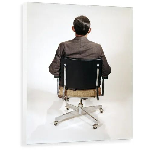 George Oliver '1960s Business Man Back View Sitting In Office Chair' Photograph George Oliver Format: Wrapped Canvas, Size: 100 cm H x 78.2 cm W x 3.8 cm D  - Size: 50 cm H x 70 cm W x 2.3 cm D