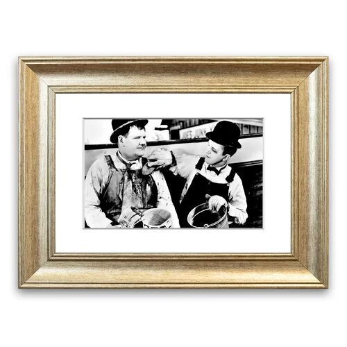 East Urban Home 'Laurel And Hardy Towed In the Hole' Framed Photographic Print East Urban Home Size: 50 cm H x 70 cm W, Frame Options: Silver Antique  - Size: 93cm H x 126cm W x 1cm D