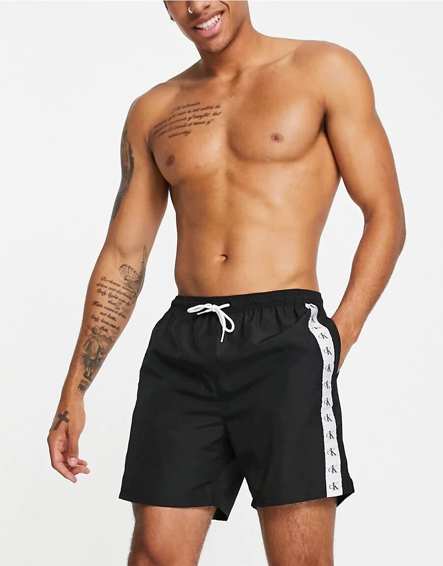 Calvin Klein swim shorts with logo side taping in black  Black