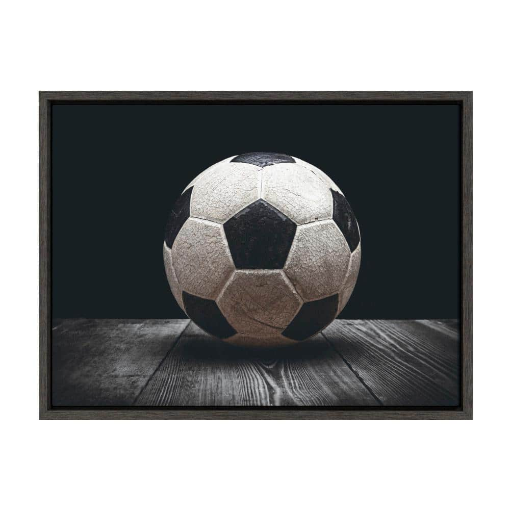 DesignOvation Sylvie "Vintage Soccer Ball on Black" by Saint and Sailor Studios 24 in. x 18 in. Framed Canvas Wall Art