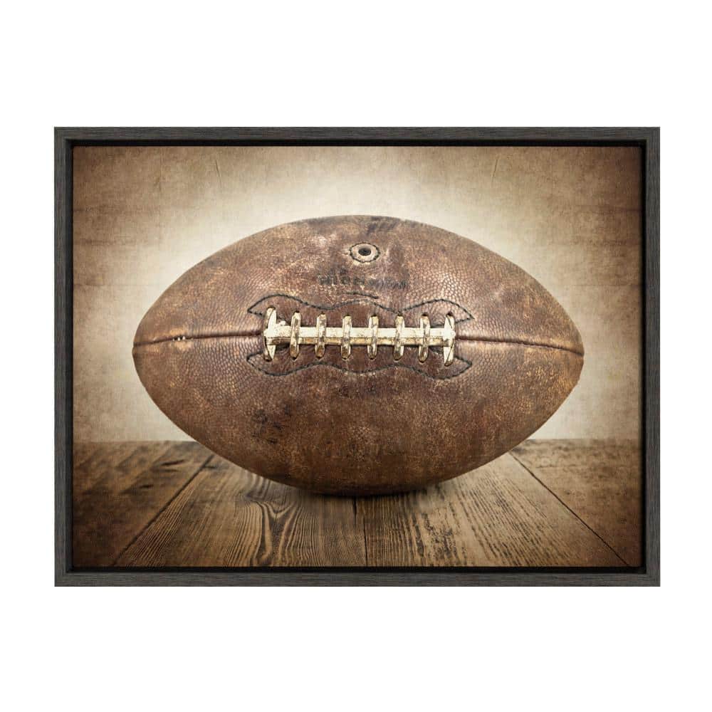 DesignOvation Sylvie "Vintage Football" by Saint and Sailor Studios 24 in. x 18 in. Framed Canvas Wall Art