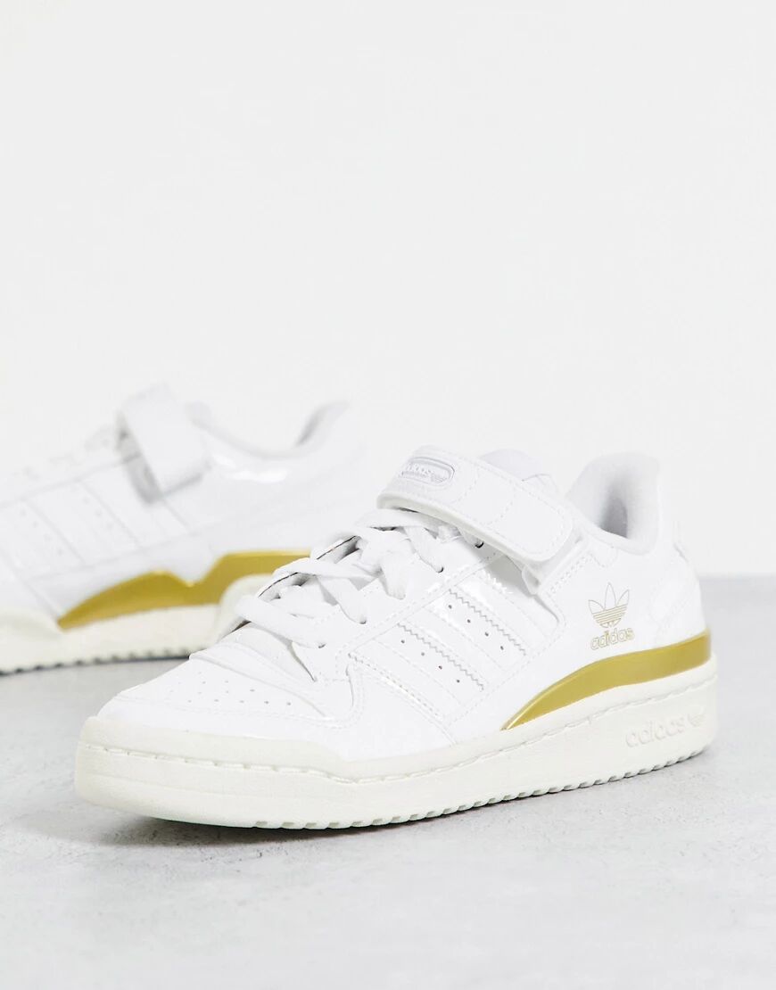 adidas Originals Forum Low trainers in patent white and gold  White