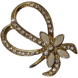 Broche nœud Bijou en métal doré et strass brillants Doré - Publicité