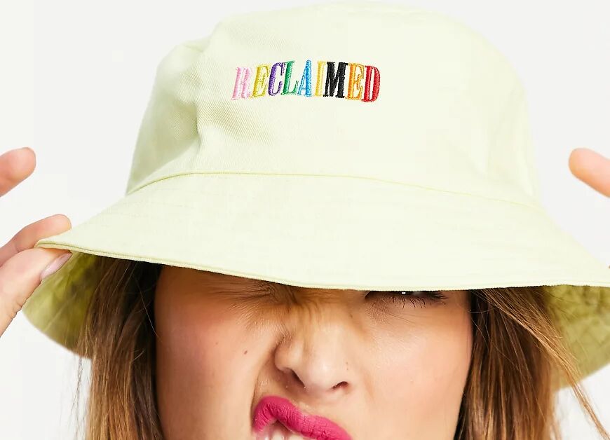 Reclaimed Vintage inspired bucket hat with rainbow logo embroidery in yellow  Yellow