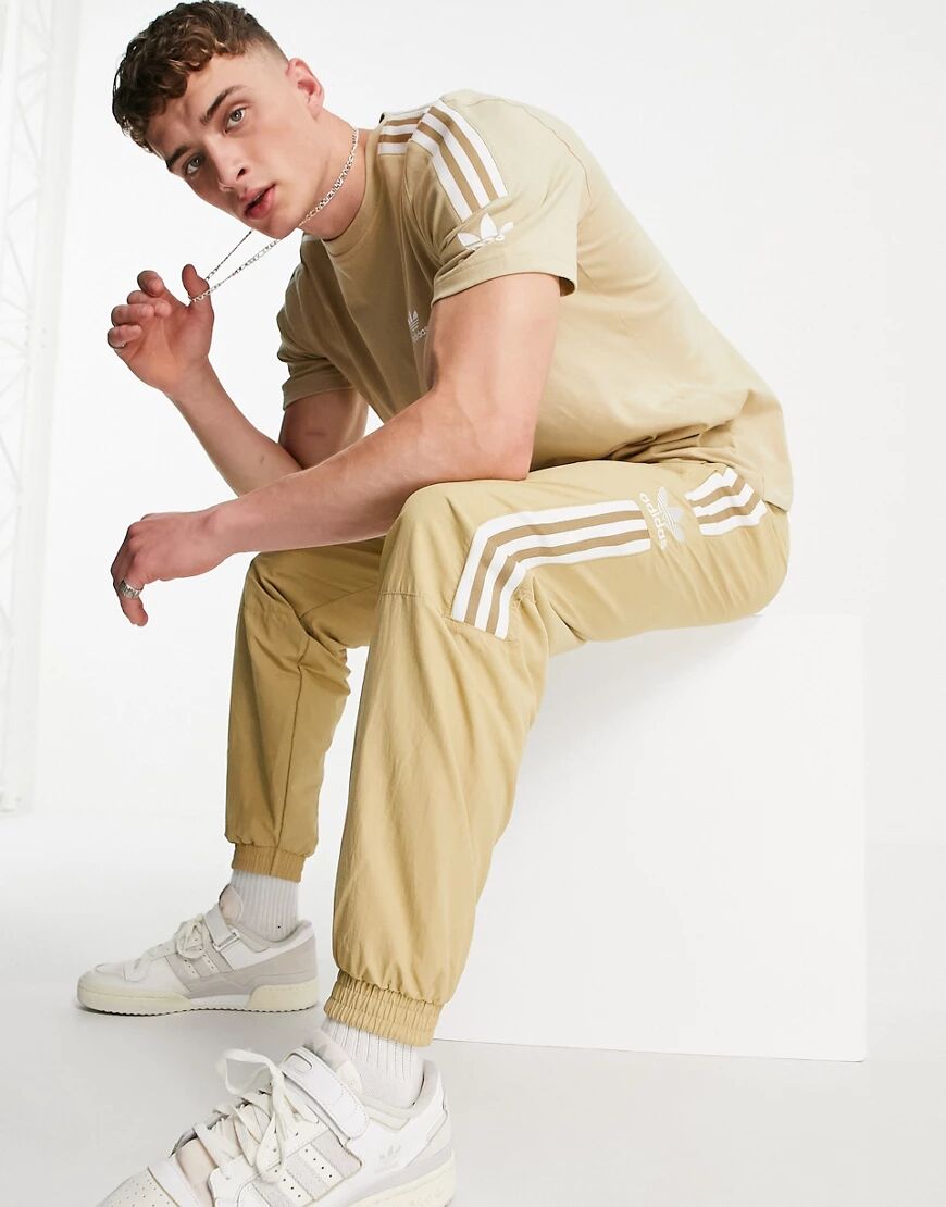 adidas Originals adicolor lock up joggers in beige-Neutral  Neutral