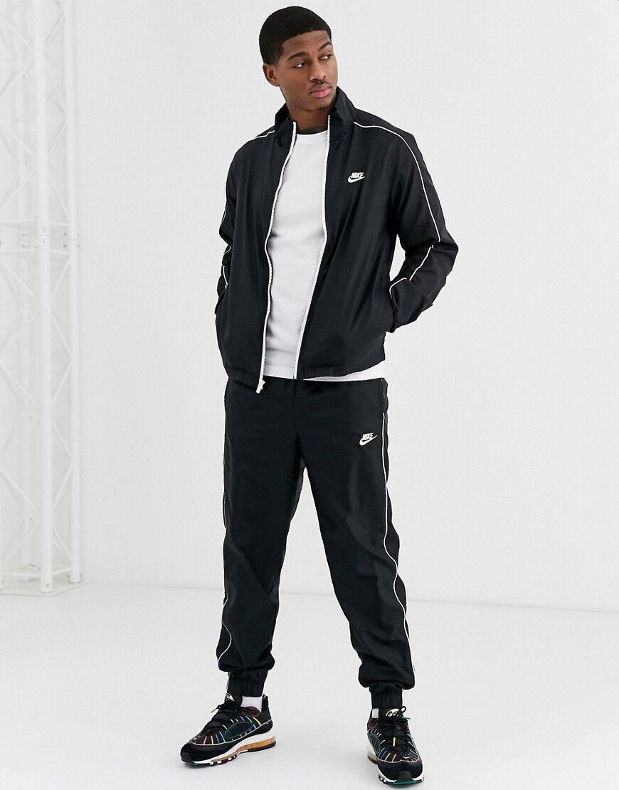 Nike woven tracksuit set in black  Black