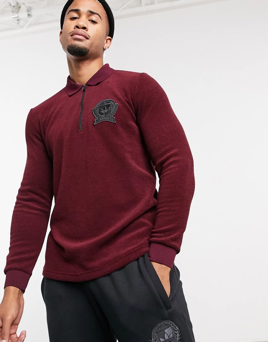 adidas Originals long sleeve polo top with collegiate crest in burgundy terry toweling-Red  Red