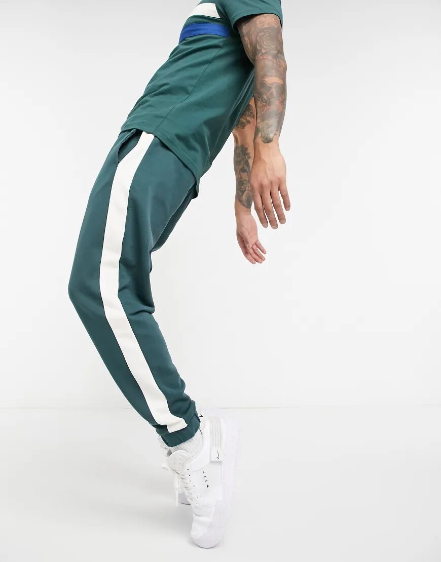 ASOS DESIGN co-ord tapered joggers with side stripe in deep green  Green