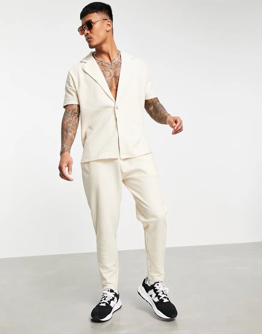 ASOS DESIGN co-ord waffle tapered joggers in cream with fixed hem-Neutral  Neutral