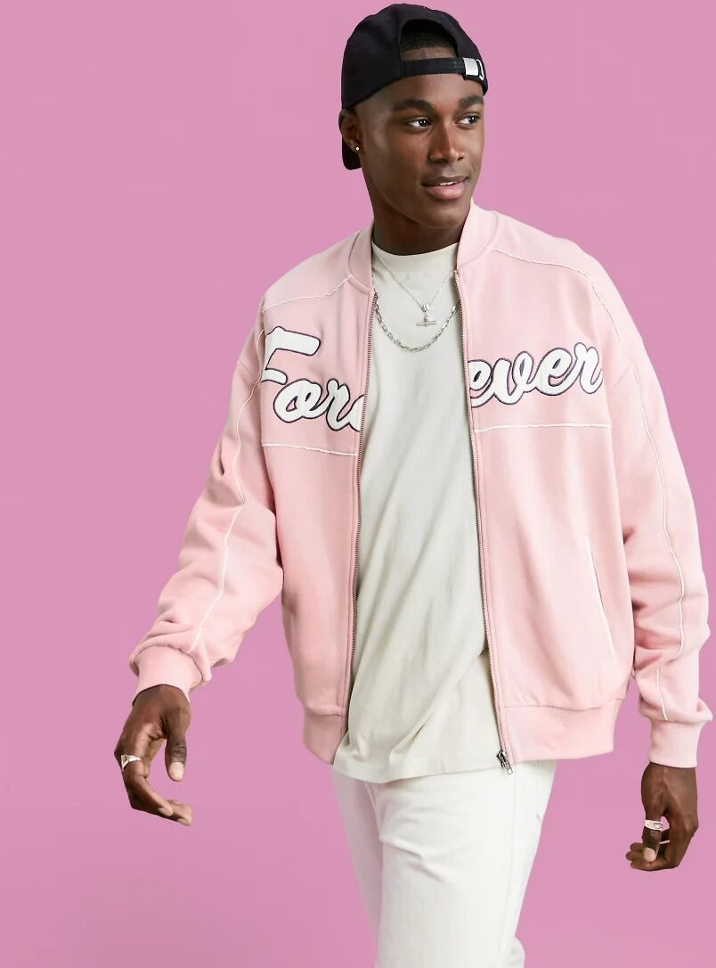 ASOS DESIGN oversized jersey bomber jacket in pink with large text applique  Pink