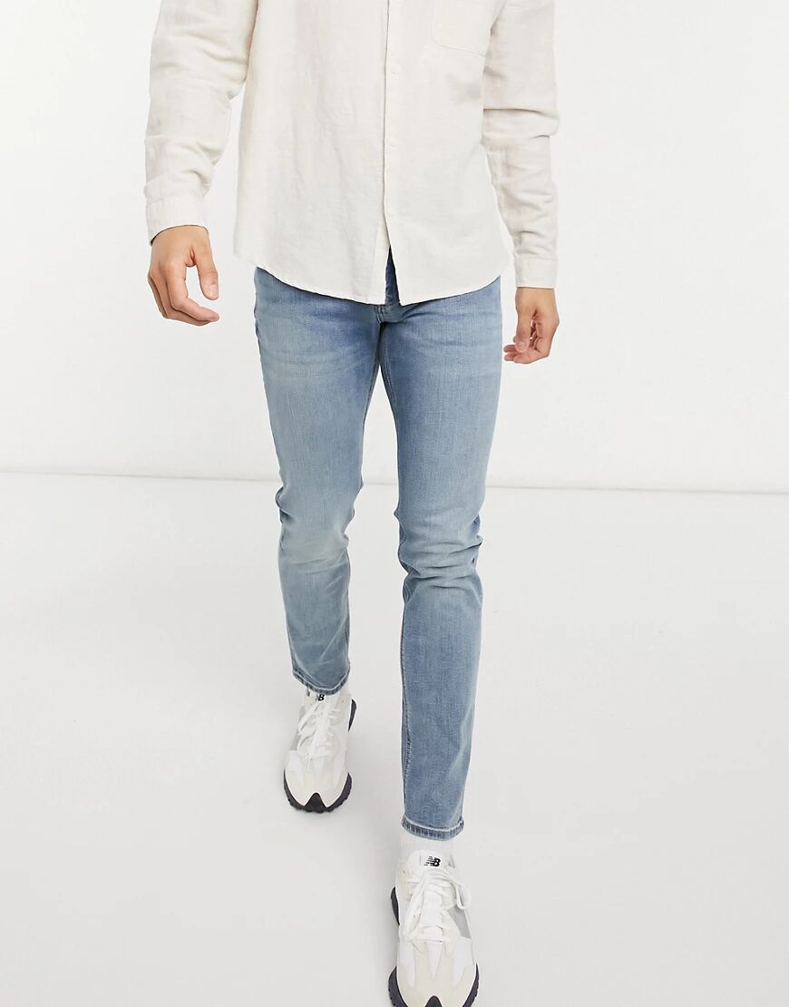 ASOS DESIGN skinny jeans in mid wash-Blue  Blue