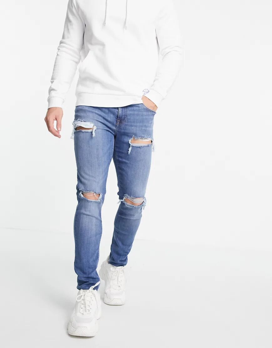 ASOS DESIGN skinny jeans in mid wash with heavy rips-Blue  Blue