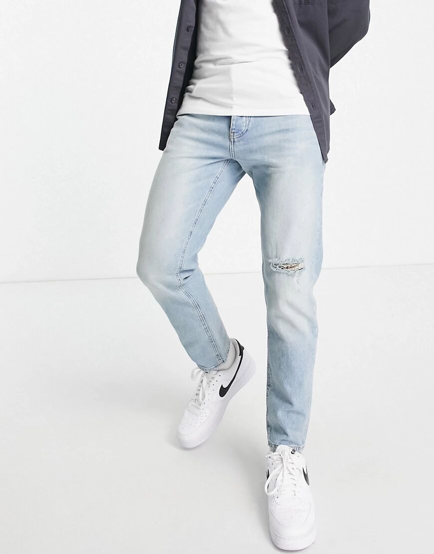 ASOS DESIGN tapered jeans in vintage light wash with rip-Blue  Blue