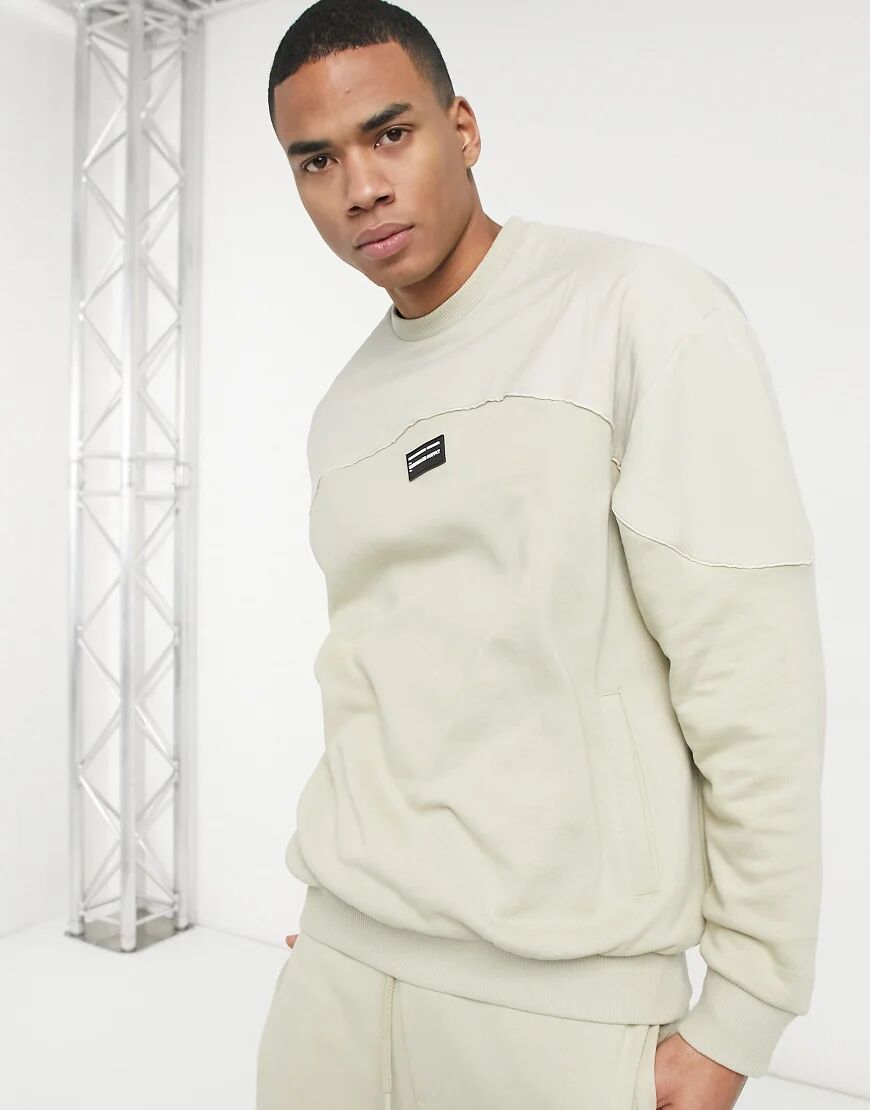 ASOS Unrvlld Spply oversized sweatshirt in beige with nylon colour block panels-Neutral  Neutral