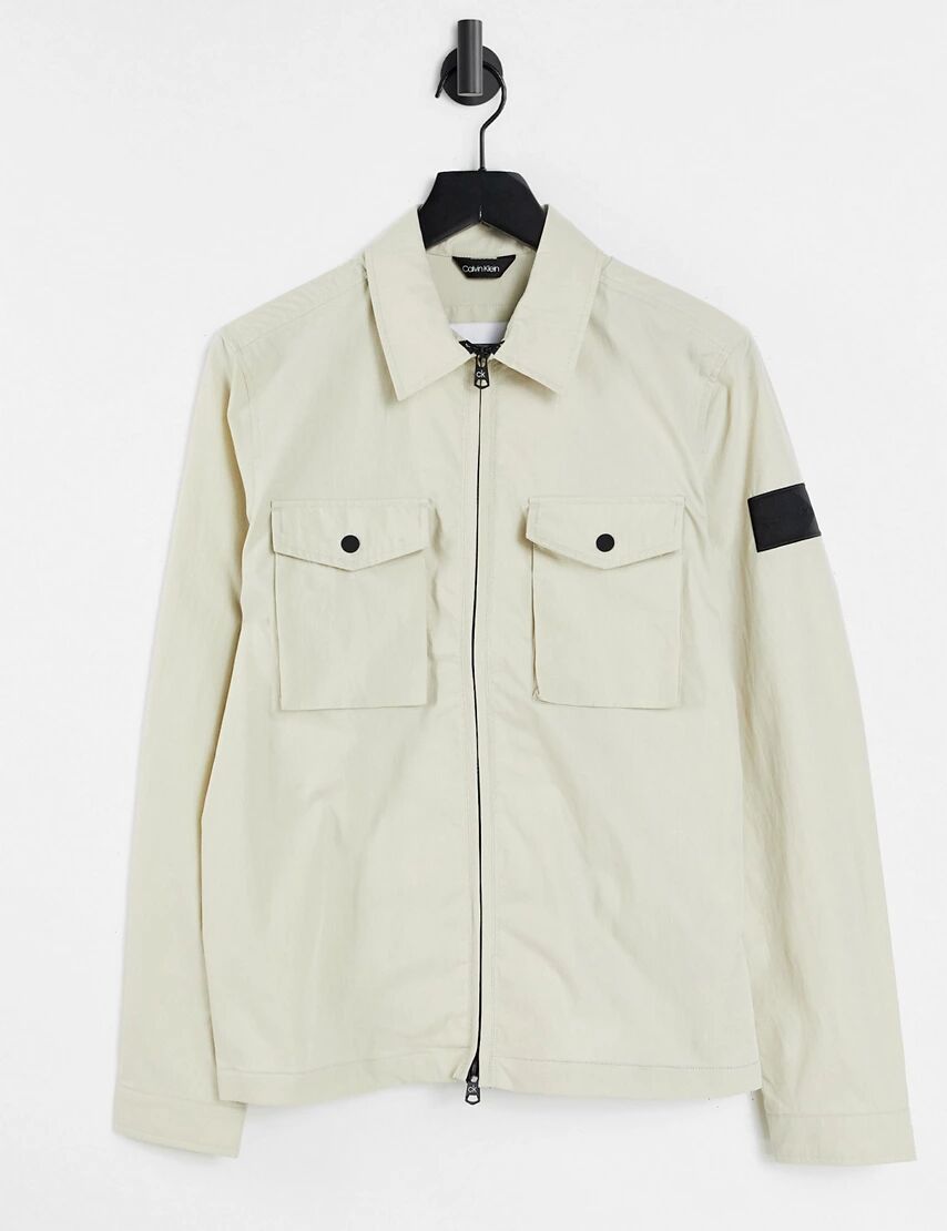 Calvin Klein badge logo 2 pocket zip front shirt jacket in bleached stone-Neutral  Neutral