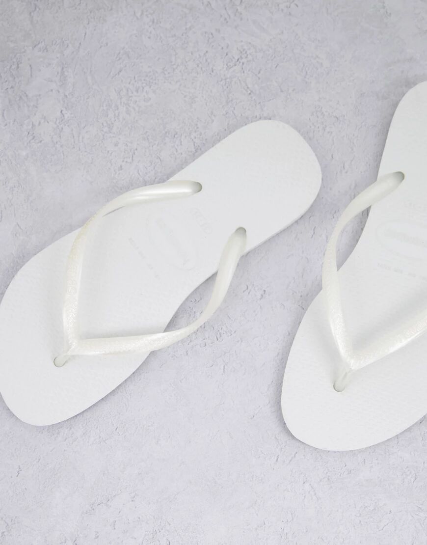Havaianas slim flip flops in white  White