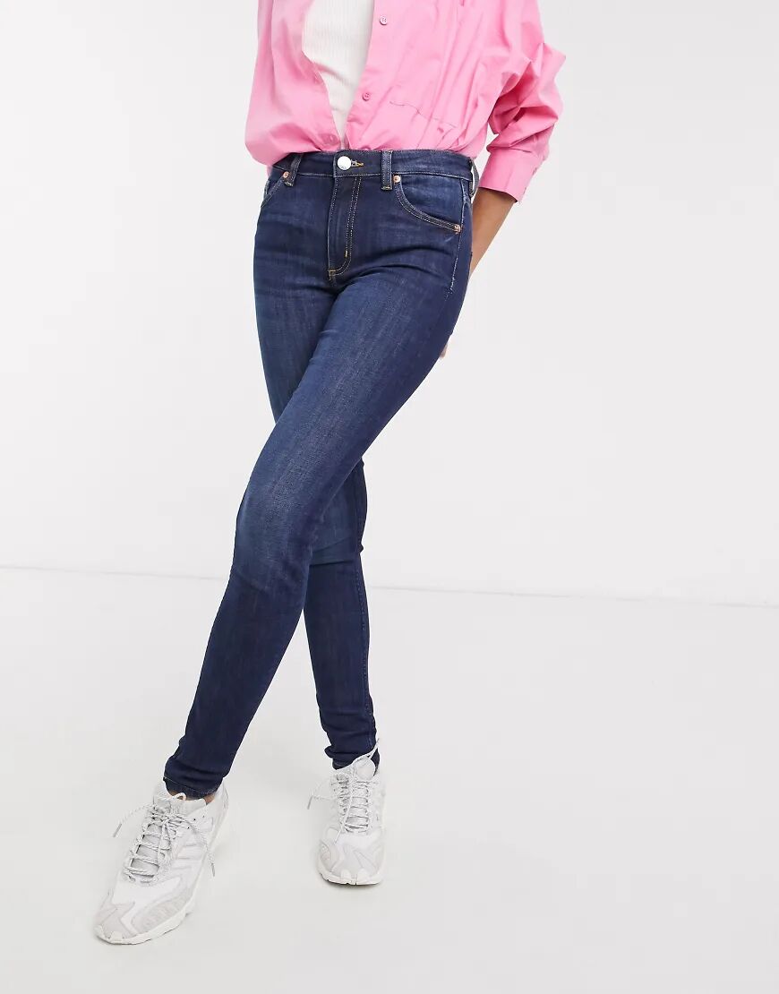 Monki Mocki organic cotton blend mid waist slim jeans in mid blue  Blue