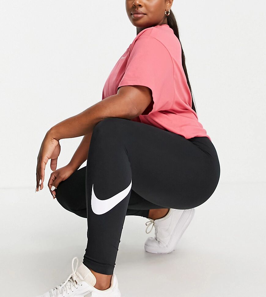 Nike Plus essential leggings in black with swoosh print  Black