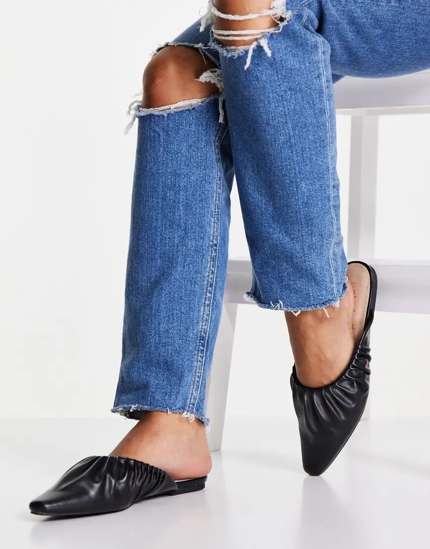 schuh Larkin backless mules in black  Black