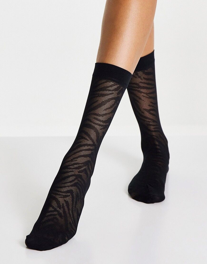 ASOS DESIGN calf length sheer socks in zebra print in black  Black