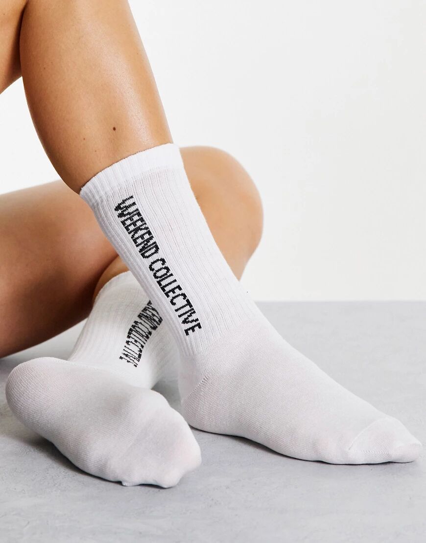 ASOS DESIGN ASOS Weekend Collective calf length rib socks with horizontal logo in white  White