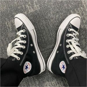 Chaussures plates Converse Chuck Taylor All -Star noires hautes M9160C - Publicité