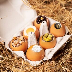 Compagnie Générale de Biscuiterie Boite contenant 6 œufs en chocolat avec une présentation Coco, oranges confites, pistaches, Caviar (Paris) - Publicité