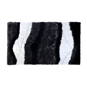 OZAIA Tapis shaggy a poils longs ECUME - tufte main - Noir et Blanc - 140 x 200 cm