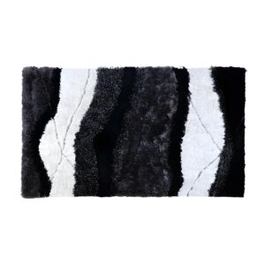 OZAIA Tapis shaggy à poils longs ECUME - tufté main - Noir et Blanc - 140 x 200 cm