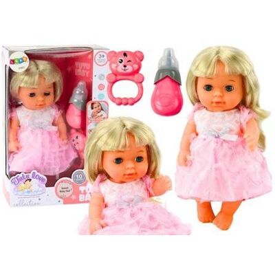 Lean Toys Eine Puppe in einem hellrosa Kleid, die auf eine Flasche pinkelt Lean Toys Eine Puppe in einem hellrosa Kleid, die auf eine Flasche pinkelt