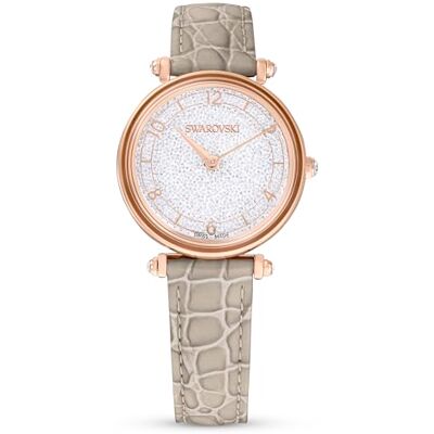 Swarovski Montre Crystalline Wonder avec un bracelet en cuir beige et des finitions or rose Swarovski Montre Crystalline Wonder avec un bracelet en cuir beige et des finitions or rose