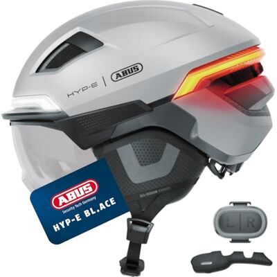 ABUS Fahrradhelm HYP-E BL.ACE mit Front-, Rück- und Blinklicht sowie kabellos zu aktivierendem Bremslicht mit Visier (klar) und Ohrenschützern für Fahrrad, E-Bike und S-Pedelec Größe L, Silber ABUS Fahrradhelm HYP-E BL.ACE mit Front-, Rück- und Blinklicht sowie kabellos zu aktivierendem Bremslicht mit Visier (klar) und Ohrenschützern für Fahrrad, E-Bike und S-Pedelec Größe L, Silber