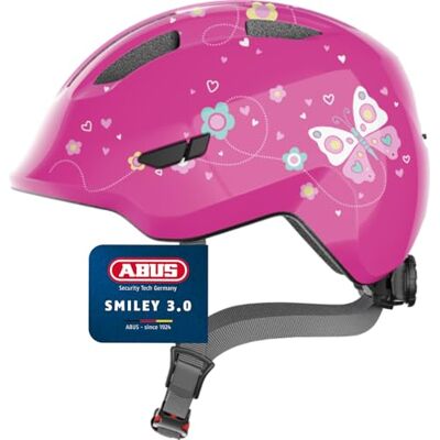 ABUS Kinderhelm Smiley 3.0 Fahrradhelm mit tiefer Passform, kindergerechten Designs & Platz für einen Zopf für Mädchen und Jungs Pink mit Schmetterlings-Muster, Größe M ABUS Kinderhelm Smiley 3.0 Fahrradhelm mit tiefer Passform, kindergerechten Designs & Platz für einen Zopf für Mädchen und Jungs Pink mit Schmetterlings-Muster, Größe M
