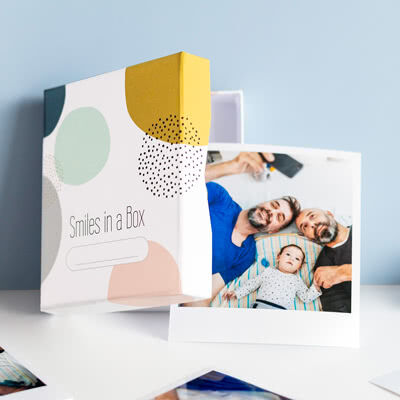 smartphoto Fotos in der Box Feder blau