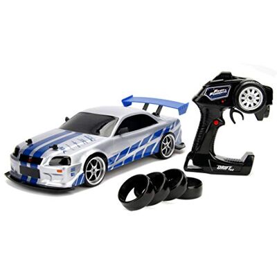 Jada Toys Fast & Furious RC Nissan Skyline GTR, R34, Driftfunktion, Ferngesteuertes Auto mit Funkfernsteuerung, Allradantrieb, 4 Ersatzreifen, USB Ladefunktion, Maßstab 1:10, blau/Silber Jada Toys Fast & Furious RC Nissan Skyline GTR, R34, Driftfunktion, Ferngesteuertes Auto mit Funkfernsteuerung, Allradantrieb, 4 Ersatzreifen, USB Ladefunktion, Maßstab 1:10, blau/Silber