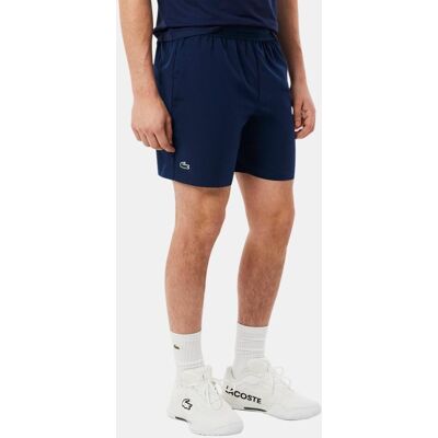 Lacoste Pantalón de hombre corto de tenis elástico Ultra-Dry. (S) Azul marino Lacoste Pantalón de hombre corto de tenis elástico Ultra-Dry. (S) Azul marino