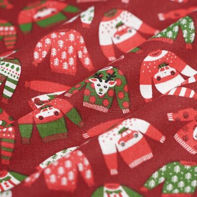 Tissu de Noël cretonne pull de Noël rouge - MT - Mondial Tissus - Publicité Tissu de Noël cretonne pull de Noël rouge - MT - Mondial Tissus - Publicité
