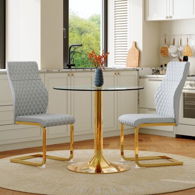 ARRIGONI Ensemble Table Et Chaises: Table Ronde En Verre De 85 Cm De Diamètre Au Style Légèrement Luxueux, Soutenue Par Des Pieds En Métal Doré. Associée À 2 Chaises De Salle À Manger Modernes En Gris Clair Et - Publicité ARRIGONI Ensemble Table Et Chaises: Table Ronde En Verre De 85 Cm De Diamètre Au Style Légèrement Luxueux, Soutenue Par Des Pieds En Métal Doré. Associée À 2 Chaises De Salle À Manger Modernes En Gris Clair Et - Publicité