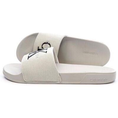 Claquette Beige Homme Calvin Klein Jeans Slide Beige - Publicité Claquette Beige Homme Calvin Klein Jeans Slide Beige - Publicité