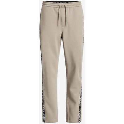 Pantalon Calvin Klein Jeans Cut Off Logo beige - XL - Publicité Pantalon Calvin Klein Jeans Cut Off Logo beige - XL - Publicité