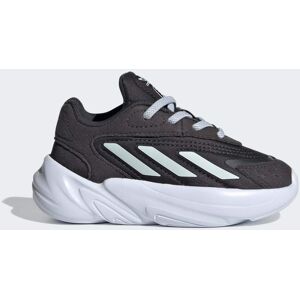 Adidas Chaussure Ozelia Carbon / Cloud White / Halo Blue - Publicité Adidas Chaussure Ozelia Carbon / Cloud White / Halo Blue - Publicité