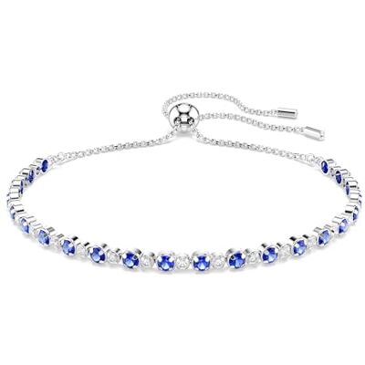Swarovski Bracelet Tennis, de la collection Matrix, avec des cristaux ronds incolores et bleus, en métal rhodié, fermoir à boule coulissante - Publicité Swarovski Bracelet Tennis, de la collection Matrix, avec des cristaux ronds incolores et bleus, en métal rhodié, fermoir à boule coulissante - Publicité