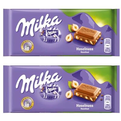 Milka Chocolat au Lait et Noisettes Entières du Pays Alpin 1x100g - Publicité Milka Chocolat au Lait et Noisettes Entières du Pays Alpin 1x100g - Publicité