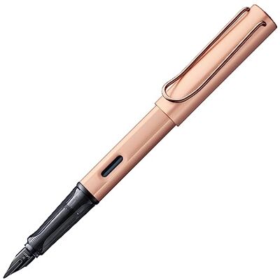 Lamy Stylo plume Lx en rosegold Plume revêtue de PVD et prise ergon. Plume en acier de taille M Corps léger en aluminium Cartouche d'encre bleue T 10 et un étui métal Pour droitiers - Publicité Lamy Stylo plume Lx en rosegold Plume revêtue de PVD et prise ergon. Plume en acier de taille M Corps léger en aluminium Cartouche d'encre bleue T 10 et un étui métal Pour droitiers - Publicité
