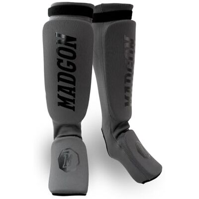 MADGON Protège Tibias Boxe à Ajustement Parfait et Rembourrage Optimal – Protège Tibia Minimisant la Transpiration Protège Tibia Boxe Thaï, et pour Arts Martiaux, MMA, Kickboxing avec Pochette - Publicité MADGON Protège Tibias Boxe à Ajustement Parfait et Rembourrage Optimal – Protège Tibia Minimisant la Transpiration Protège Tibia Boxe Thaï, et pour Arts Martiaux, MMA, Kickboxing avec Pochette - Publicité