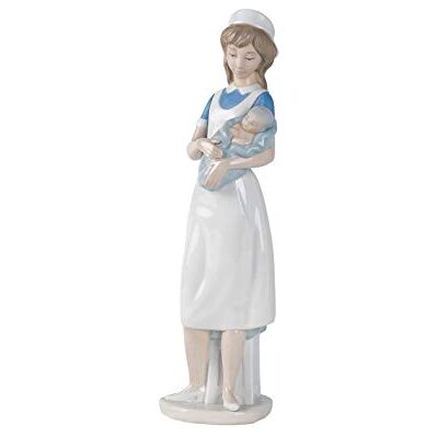 NAO Nurse. Decorative Figure of a Nurse with Baby in Arms in Glossy Porcelain. Ornamental Sculpture Representing a Health Professional for Home Decoration NAO Nurse. Decorative Figure of a Nurse with Baby in Arms in Glossy Porcelain. Ornamental Sculpture Representing a Health Professional for Home Decoration