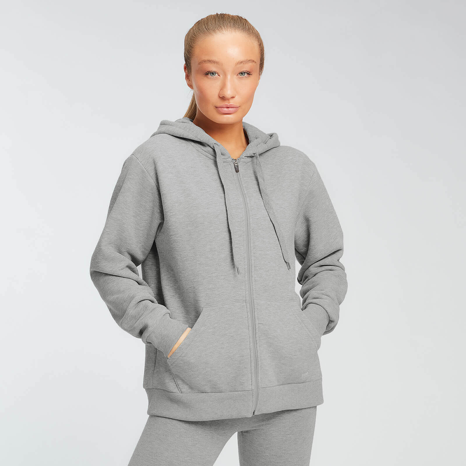 Myprotein Felpa con cappuccio e cerniera MP Essentials da donna - Grigio mélange - XXS Myprotein Felpa con cappuccio e cerniera MP Essentials da donna - Grigio mélange - XXS